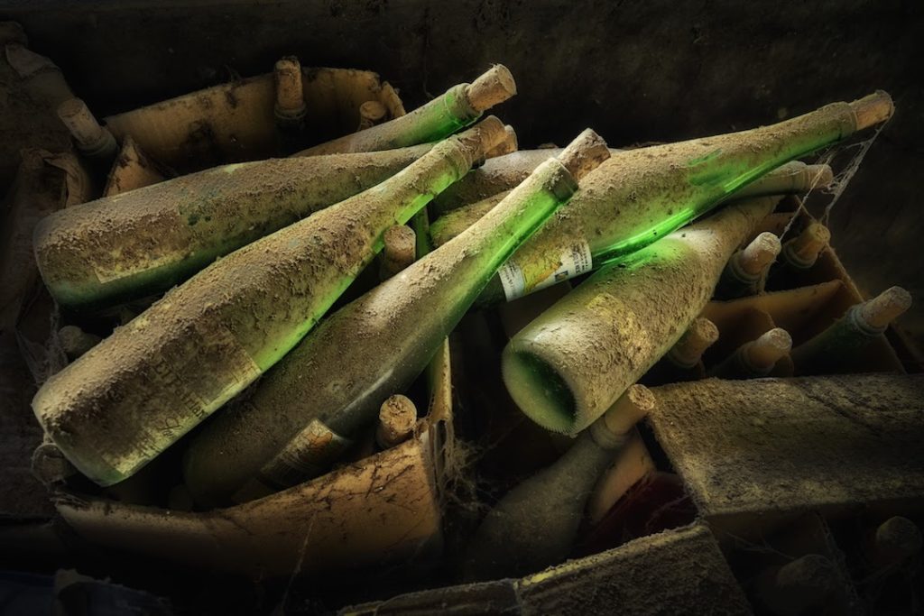 Old wine bottles covered in dirt