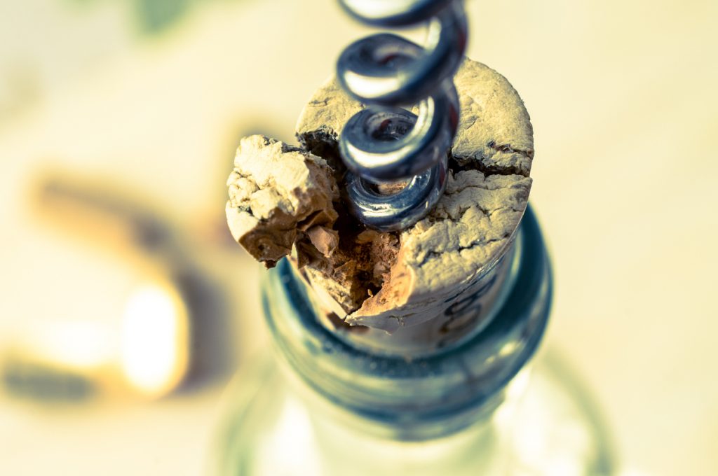 broken cork with corkscrew in it