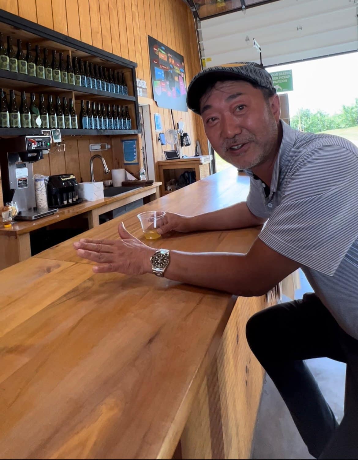 Li sharing his cider excitement