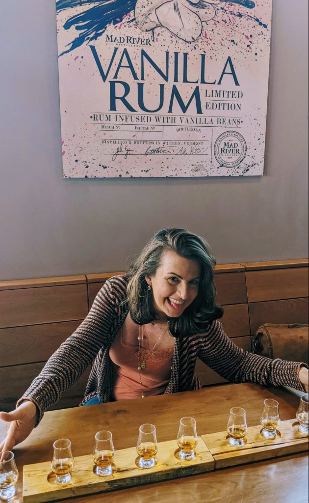 Mad River Flight with Suzanne Suzanne drinking an exceptional craft rum flight at Mad River Distillers