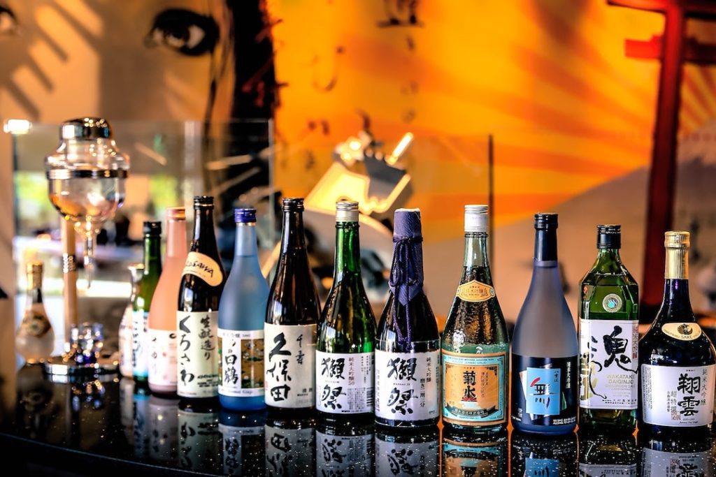 Line Up of Sake Bottles in A Japanese Bar