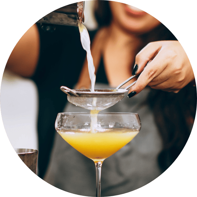 Woman pouring cocktail