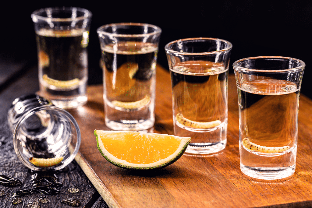 worm in tequila, four pours in shot glasses