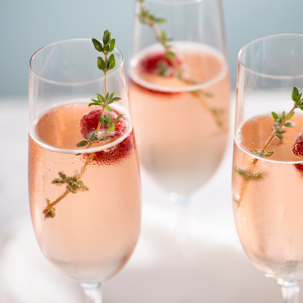3 Sake Cocktails shown with raspberry and thyme