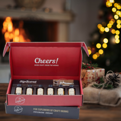 Image of SipScout's Whiskey Exploration Kit on a table in front of a fireplace